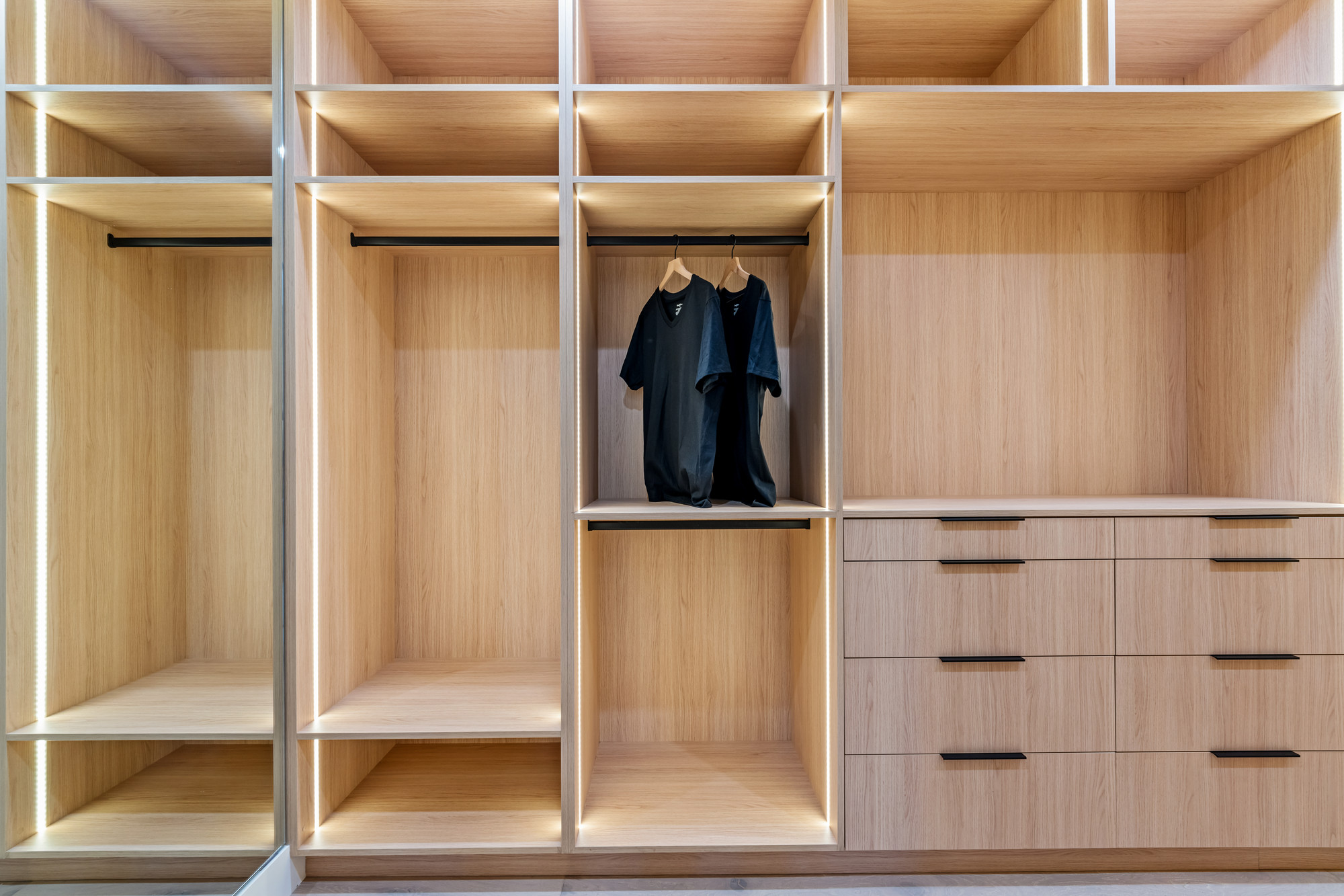 Wall-to-wall walnut interior continuity