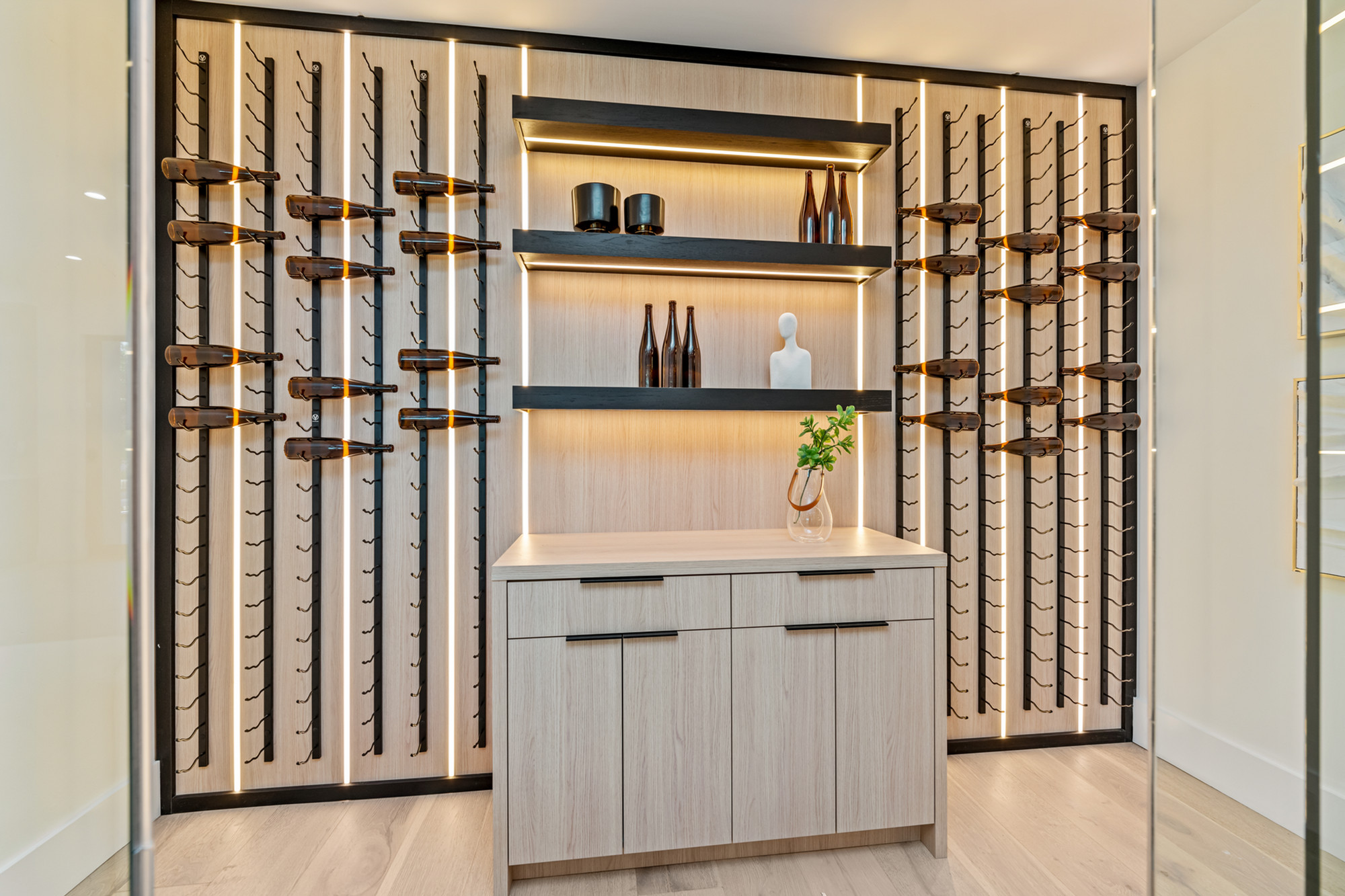 Backlit white oak wine cellar